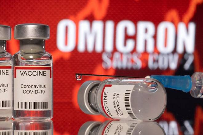 Illustration shows vials labelled "VACCINE Coronavirus COVID-19" and a syringe in front of displayed words "OMICRON SARS-COV-2