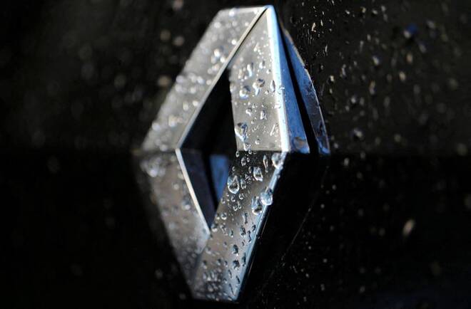 Raindrops cover the logo of French car manufacturer Renault on a car seen in Paris