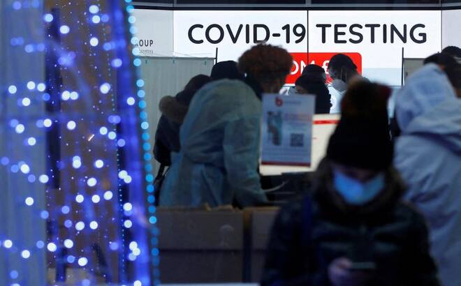 Customers are seen inside a private COVID-19 testing clinic in a busy shopping area, amid the coronavirus disease (COVID-19) outbreak in London