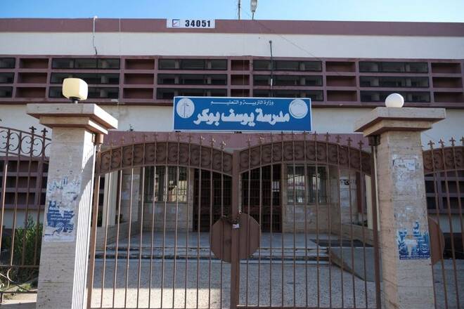 The polling station doors are closed after postponement of elections by the High National Elections Commission, in Benghazi