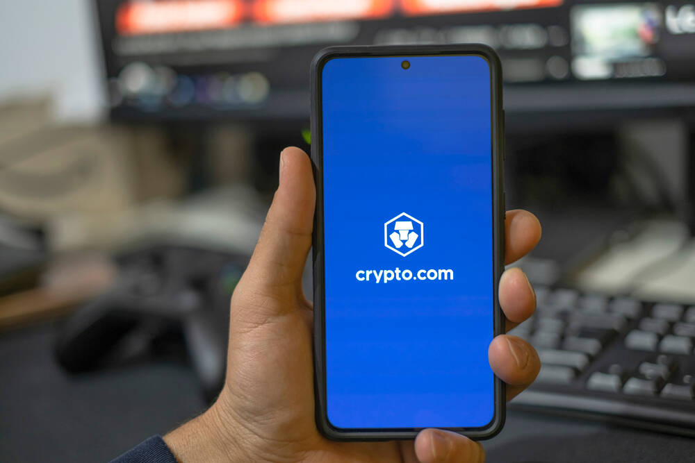 Man use crypto currency app on a smartphone,trading exchange,digital business,crypto.com