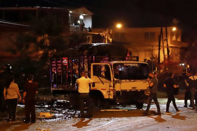 A destroyed truck of the Police Mobile Anti-Riot Squad (ESMAD) is seen after an explosion in Cali