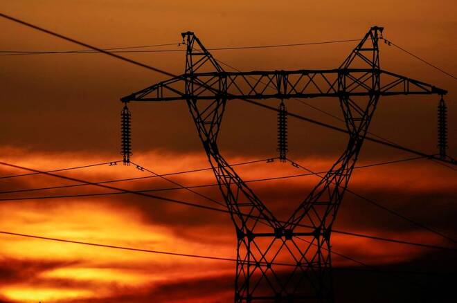 Pylons of high-tension electricity power lines are seen during sunset outside Nantes