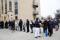 People stand in a queue for vaccination in front of a hospital as the spread of COVID-19 continues, in Budapest