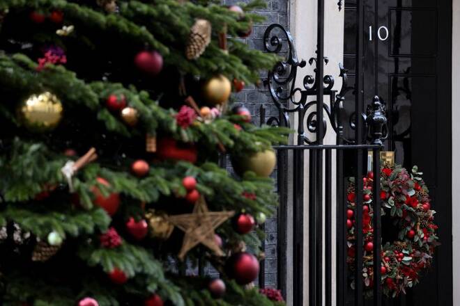 The door of 10 Downing Street is decorated with Christmas decorations in London