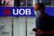 A man passes by a UOB bank branch in Singapore