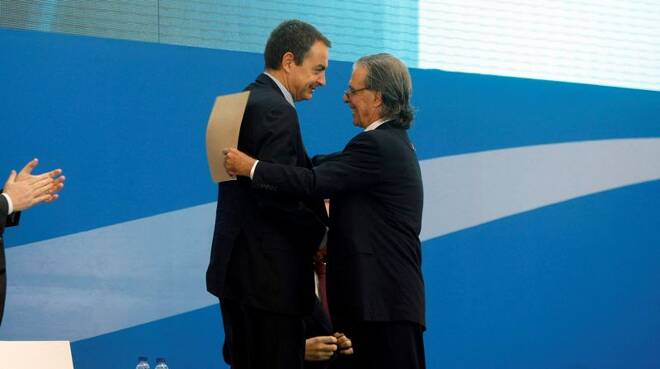 Spain's Prime Minister Zapatero embraces architect Ricardo Bofill during the inauguration of the T-1 terminal at Barcelona's El Prat airport