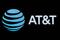 The company logo for AT&T is displayed on a screen on the floor at the NYSE in New York