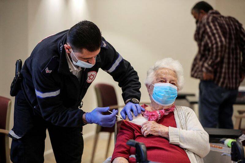 Senior citizens receive a fourth dose of the COVID-19 vaccine at a vaccination party in Israel