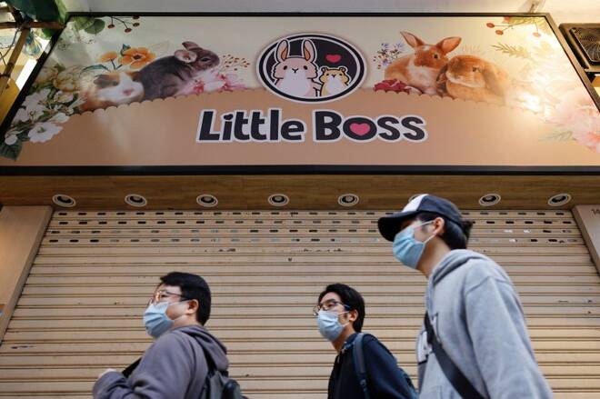 People stand in front of a closed pet shop after the government announced to euthanize around 2,000 hamsters in the city after finding evidence for the first time of possible animal-to-human transmission of coronavirus disease (COVID-19) in Hong Kong
