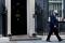British Prime Minister Johnson walks outside Downing Street in London