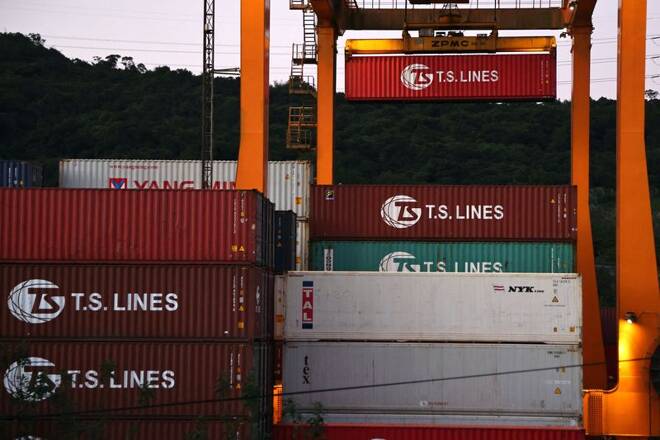 Cargo cranes are seen moving containers at a container yard in Keelung