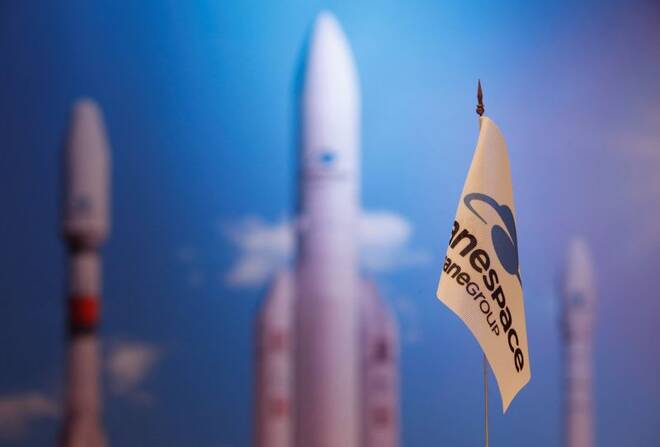 A flag with a company logo is seen during satellite launch company Arianespace annual news conference in Paris