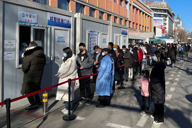 People line up to take nucleic acid tests at a testing site outside a hospital following the coronavirus disease (COVID-19) outbreak in Beijing
