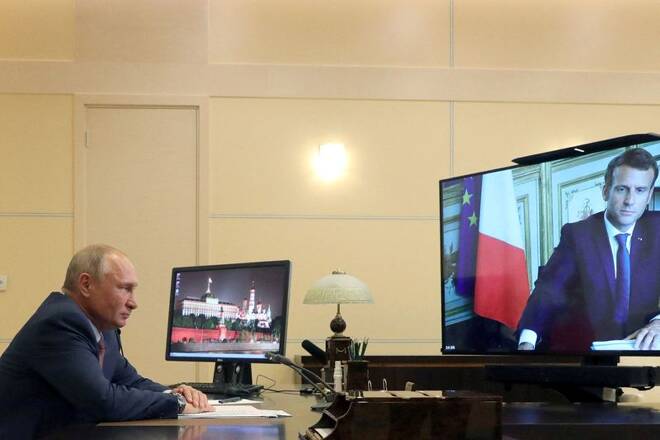Russia's President Putin speaks with his French counterpart Emmanuel Macron during a video conference call outside Moscow