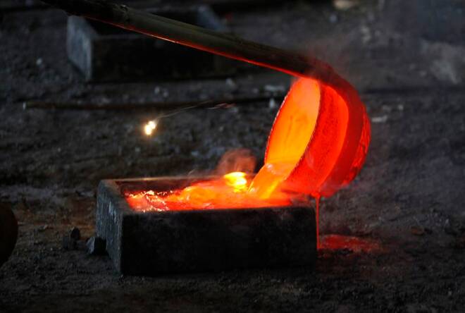 Molten rare earth metal Lanthanum is poured into a mould at a smelting workshop near the town of Damao in China's Inner Mongolia Autonomous Region