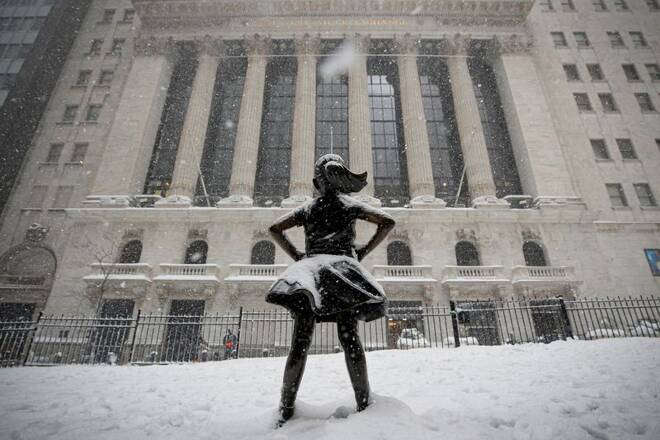 The "Fearless Girl" sculpture is seen outside NYSE during a snow storm in New York