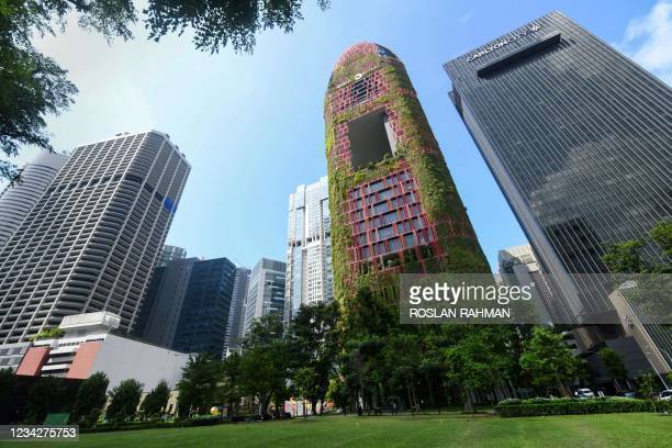 This photograph taken on July 23, 2021 shows a view of the Oasis hotel in Singapore. - Green spaces have also been shown to improve health and...