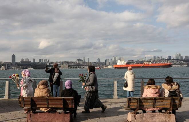 People enjoy a sunny winter day by the Bosphorus in Istanbul
