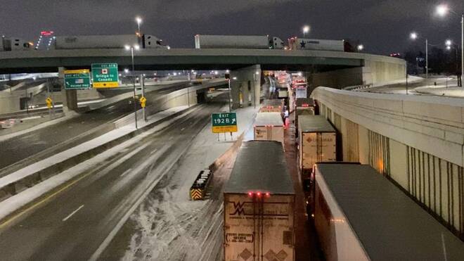 Truckers block the Ambassador Bridge on the I-75 and I-96 highways in Detroit
