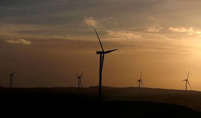 Iberdrola's power generating wind turbines are seen at dusk in Moranchon wind farm
