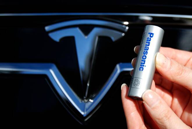 A Panasonic Corp's lithium-ion battery is pictured with Tesla Motors logo in Tokyo