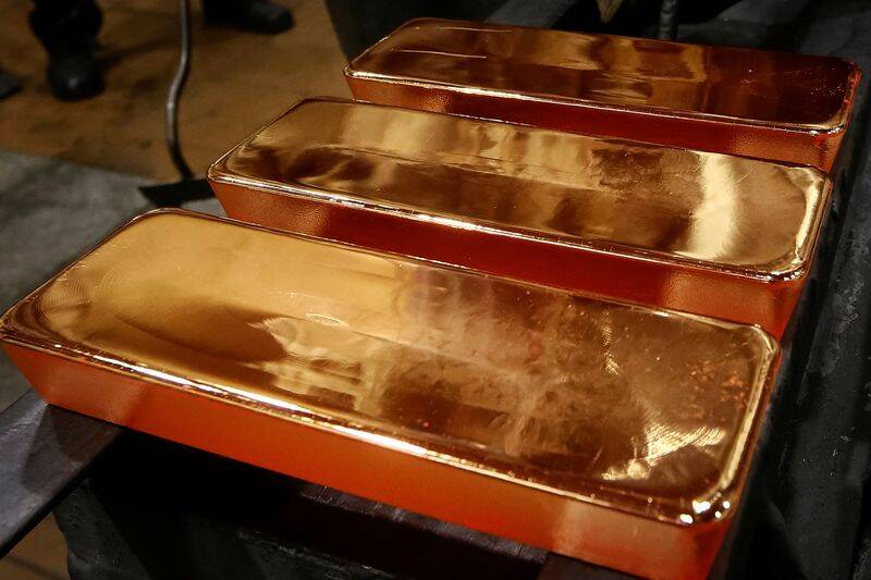 Employees process ingots of 99.99 percent pure gold at the Krastsvetmet non-ferrous metals plant in the Siberian city of Krasnoyarsk
