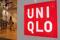 Shoppers walk inside Fast Retailing's Uniqlo casual clothing store in Tokyo