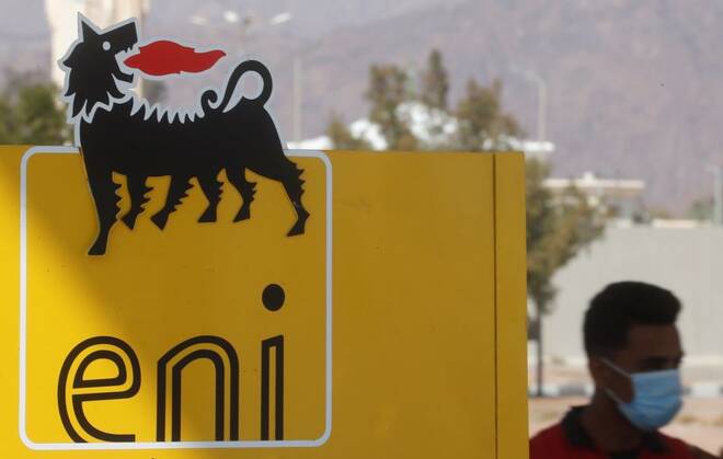 A man wearing a face mask, amid the coronavirus disease (COVID-19) pandemic, walks near the sign of Italian energy Eni company at a gas station of Egyptian International Gas Technology "Gastec" in the Red Sea resort of Sharm el-Sheikh
