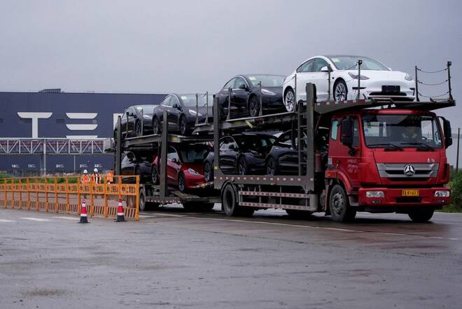 cA truck transports new Tesla cars at its factory in Shanghai