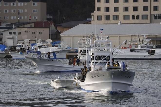 A fishing boat leaves from Utoro port for searching for the missing tour boat "Kazu 1" in Shari