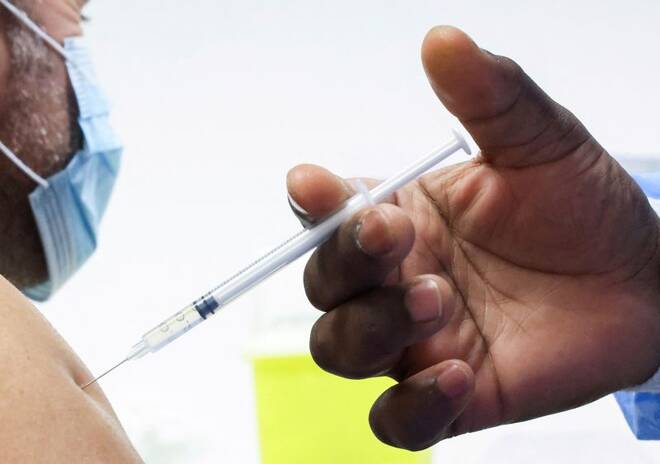 People receive a booster dose of coronavirus disease (COVID-19) vaccine in Brussels