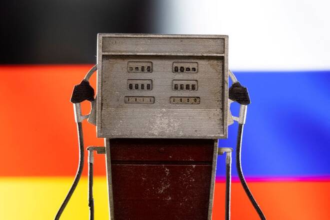 Illustration shows model of petrol pump, Germany and Russia flag colors
