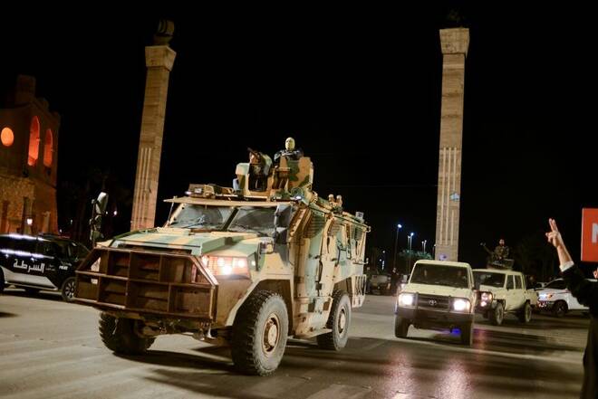 Members of the military personnel arrive to take part in a parade calling for parliamentary and presidential election, in Tripoli