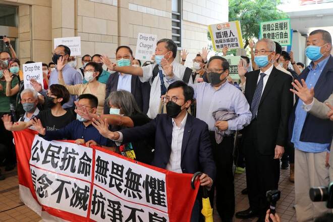 Pro-democracy activists chant slogans outside the West Kowloon Magistrates Court, in Hong Kong