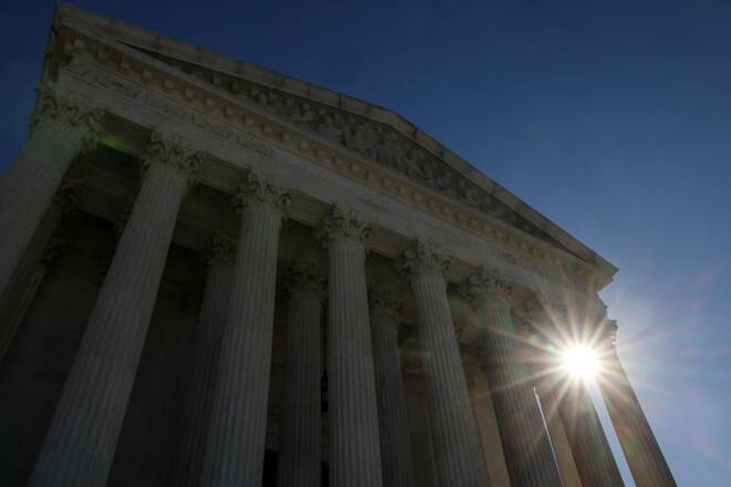 The sun rises behind the U.S. Supreme Court building the day after Election Day in Washington