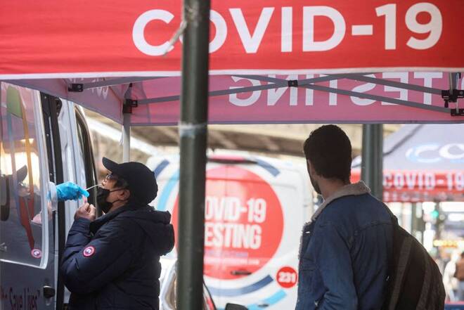 A man is given a coronavirus disease (COVID-19) test at pop-up testing site in New York