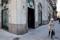 A woman walks past Banca Popolare di Milano ( BPM) downtown Milan