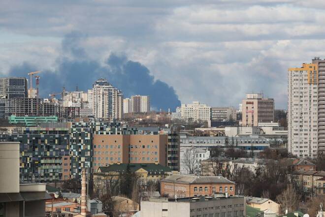 Smoke rising after shelling on the outskirts of the city is pictured from central Kyiv