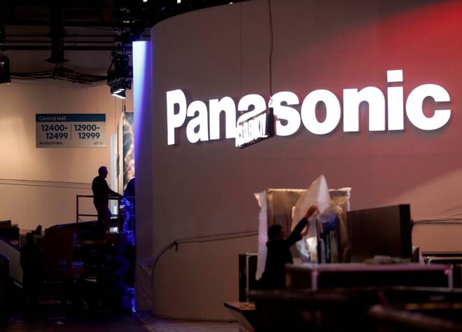 Workers set up a Panasonic booth at the Las Vegas Convention Center in preparation for 2019 CES in Las Vegas