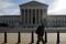 Pedestrian walks by the U.S. Supreme Court building in Washington