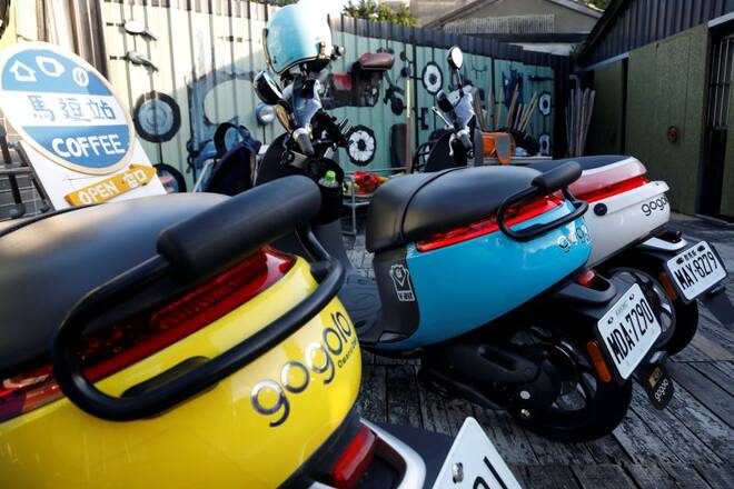 Gogoro's electric scooters are seen parked near a charging station in Taipei