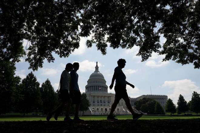 Visitors walk the grounds of the U.S. Capitol in Washington