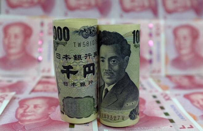 Japanese 1000-yen banknotes and Chinese 100-yuan banknotes are seen in a picture illustration, in Beijing