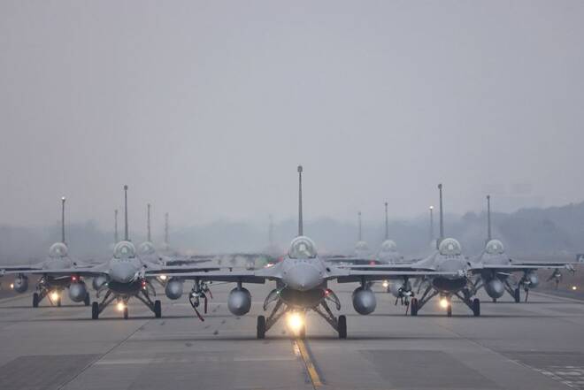 12 F-16V fighter jets perform an elephant walk during an annual New Year's drill in Chiayi