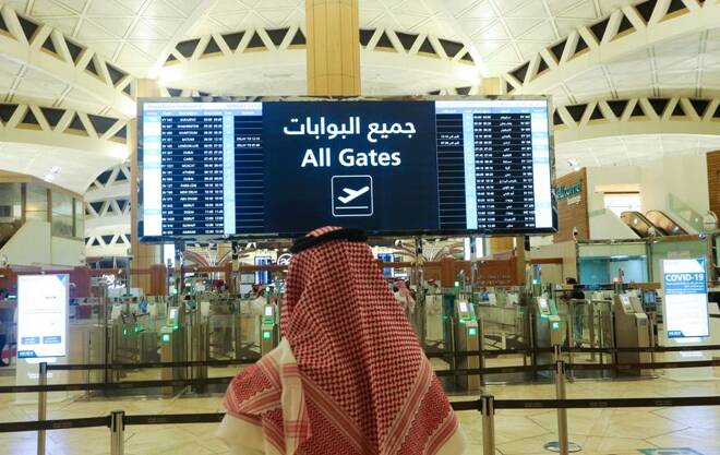 A Saudi man checks the flight timings at the King Khalid International Airport in Riyadh