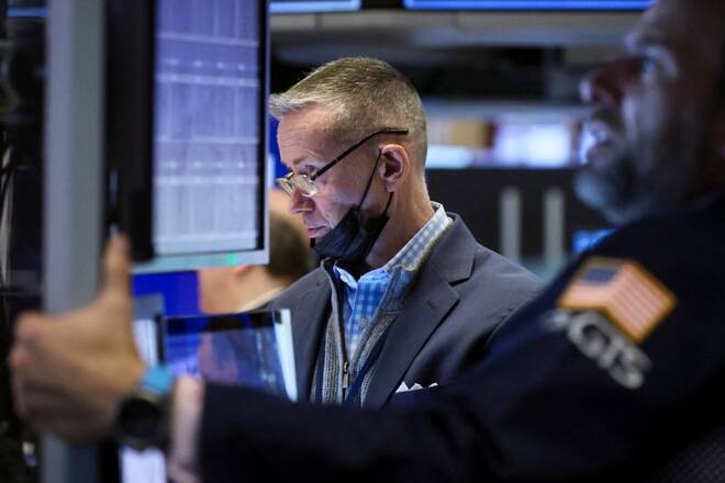 Traders work on the floor of the NYSE in New York City
