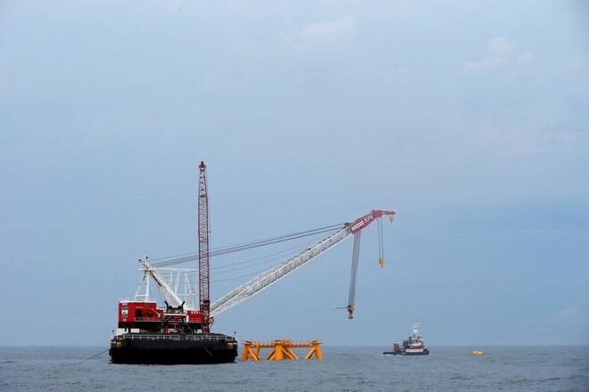Crane hangs over the first jacket installed to support a turbine for a wind farm in the waters of the Atlantic Ocean off Block Island
