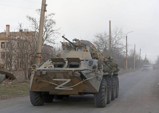 An armoured vehicle of pro-Russian troops drives along a road near the besieged city of Mariupol