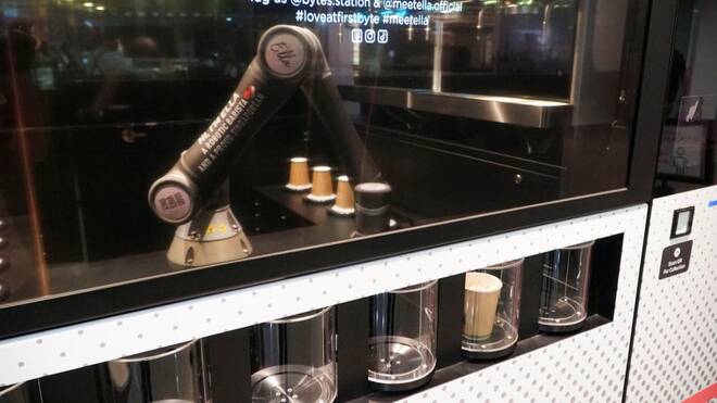 Robot barista "Ella", designed by Crown Digital, makes a coffee autonomously after receiving orders, in Singapore